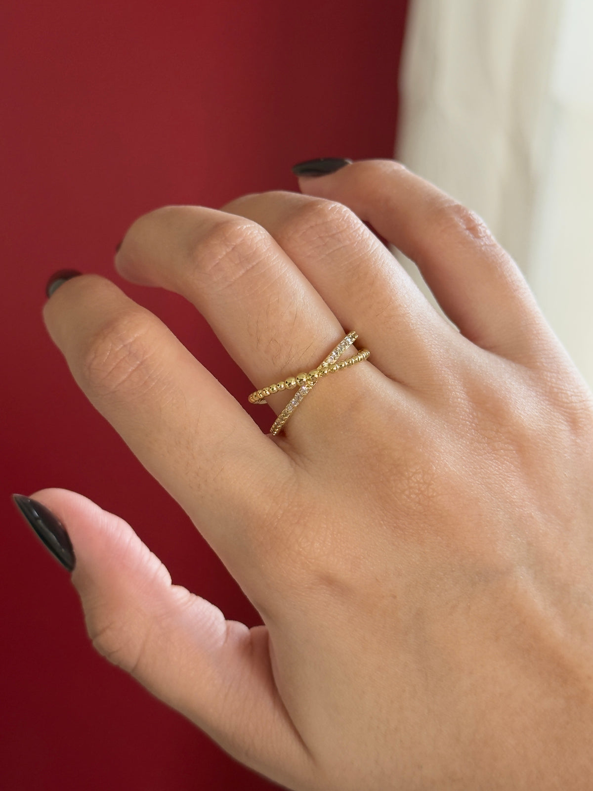 Anillo cruzado con pelotas